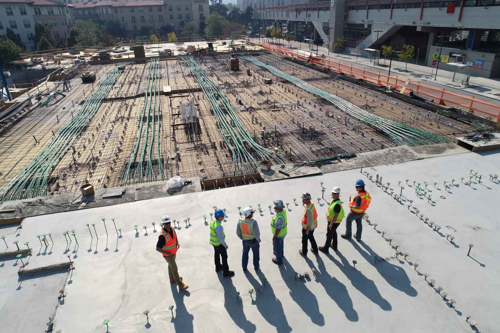 Cutech site team in hard hats reviewing work on site
